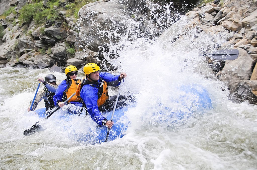 A group of friends whitewater raft on Clear Creek in Colorado